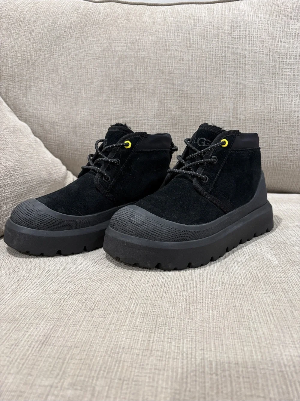 UGG (size: Men 4/ Women 5.5) Black Suede Lug Ankle Boots with Yellow Eyelet
